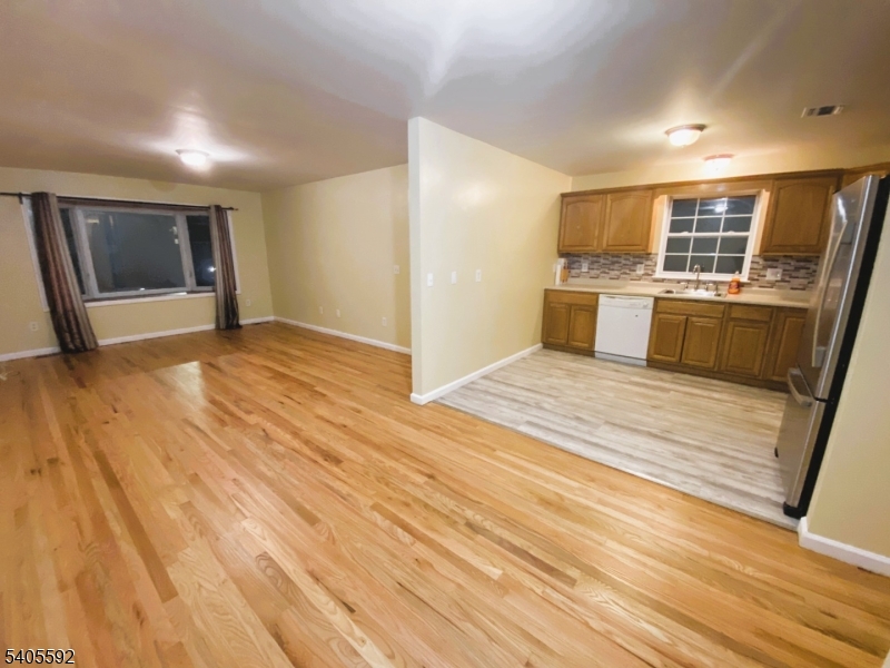 94 Palm Street, Unit 1 Newark, NJ 07106 - Photo 20 of 24 a view of a kitchen with wooden floor and electronic appliances