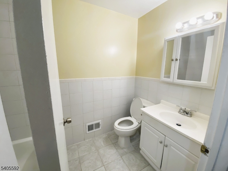 94 Palm Street, Unit 1 Newark, NJ 07106 - Photo 23 of 24 a bathroom with a sink and a toilet