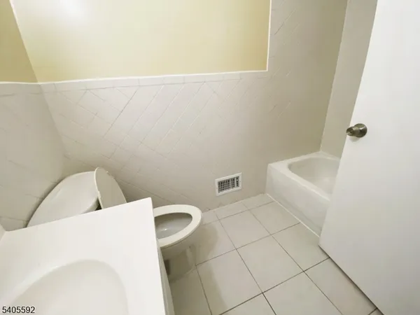 a bathroom with a toilet and sink