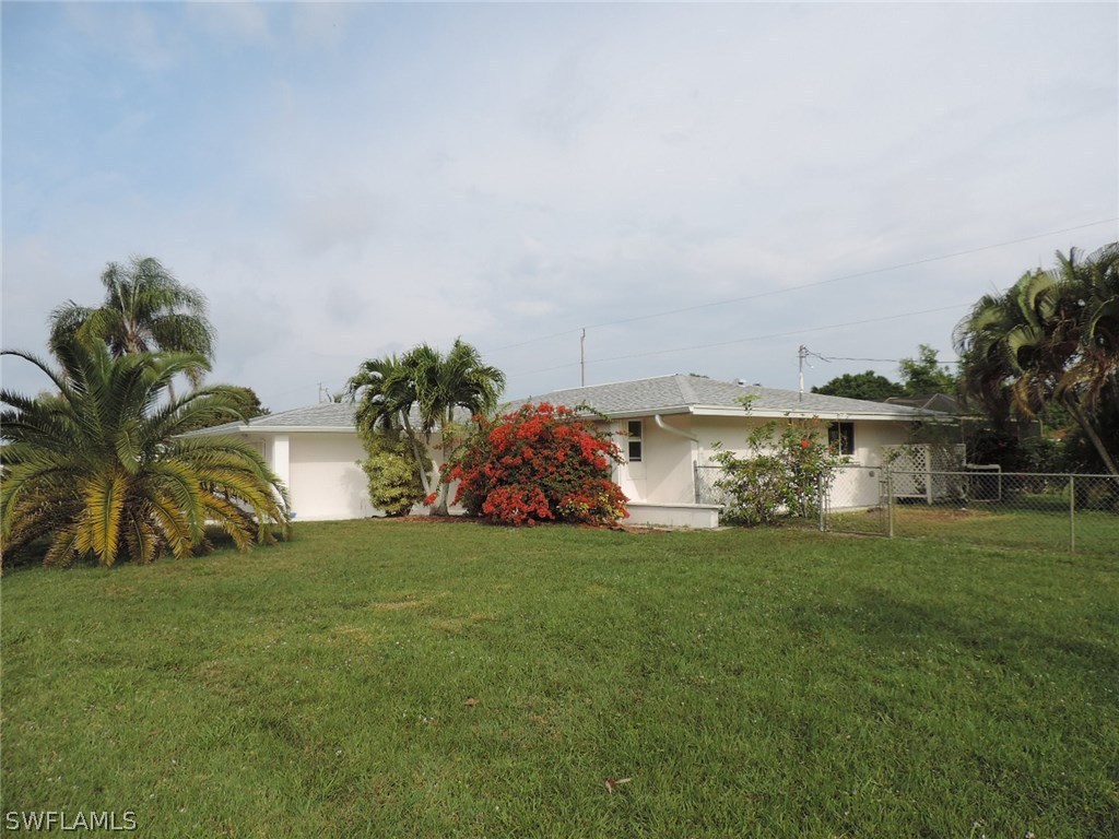 5792 Tarpon Road Bokeelia, FL 33922 - Photo 3 of 24 a view of a house with a yard and sitting area