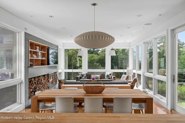a view of a dining room with furniture window and outside view