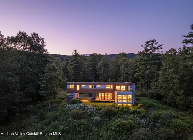 a view of a house with a street