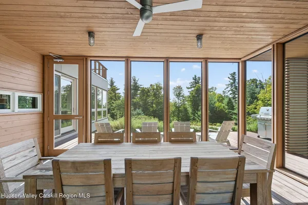 a dining table chair with a glass door