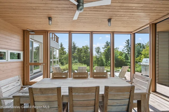 a dining table chair with a glass door