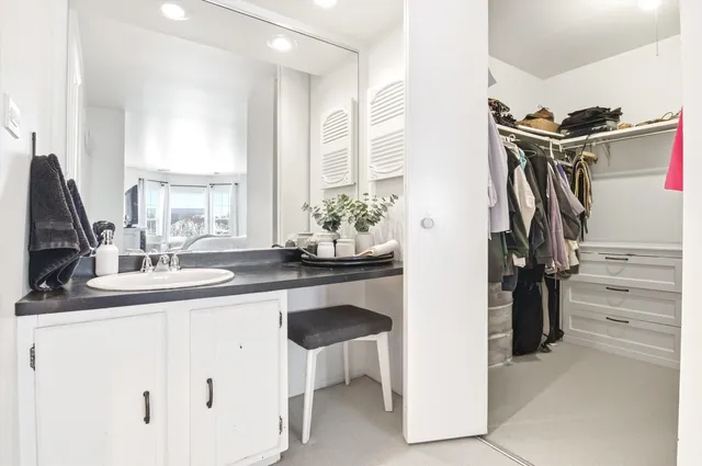 a kitchen with a sink and refrigerator