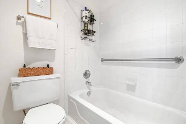 a bathroom with a sink a toilet and bathtub