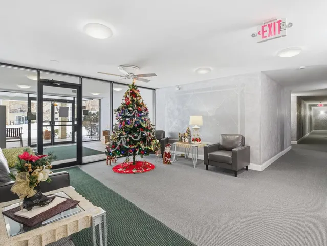 a living room with furniture and flowers