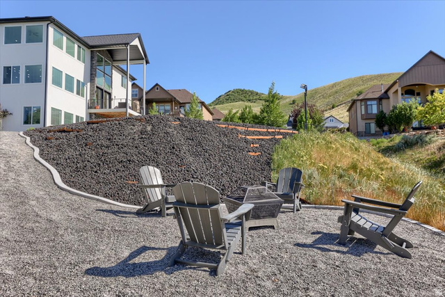 828 South Deer Road Tooele, UT 84074 - Photo 44 of 51 Outdoor fire pit area with gravel hardscaping