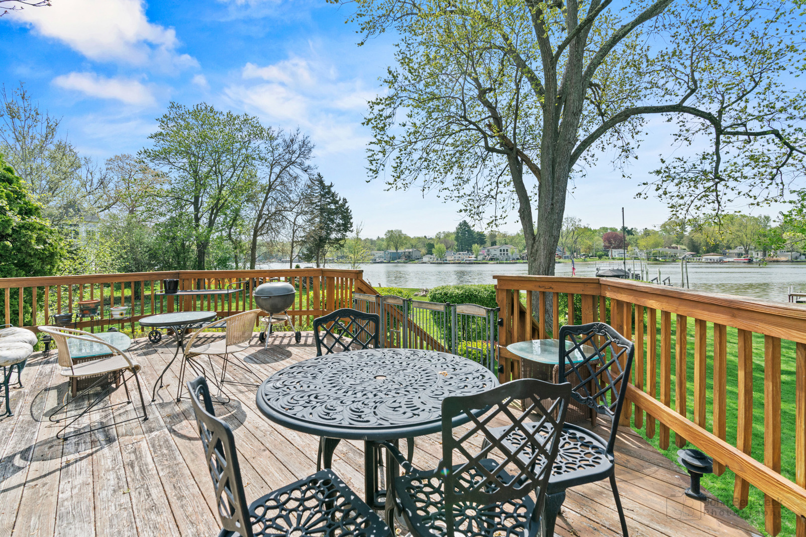1307 Tower Lane Cary, IL 60013 - Photo 12 of 26 a view of a chairs and table on the deck