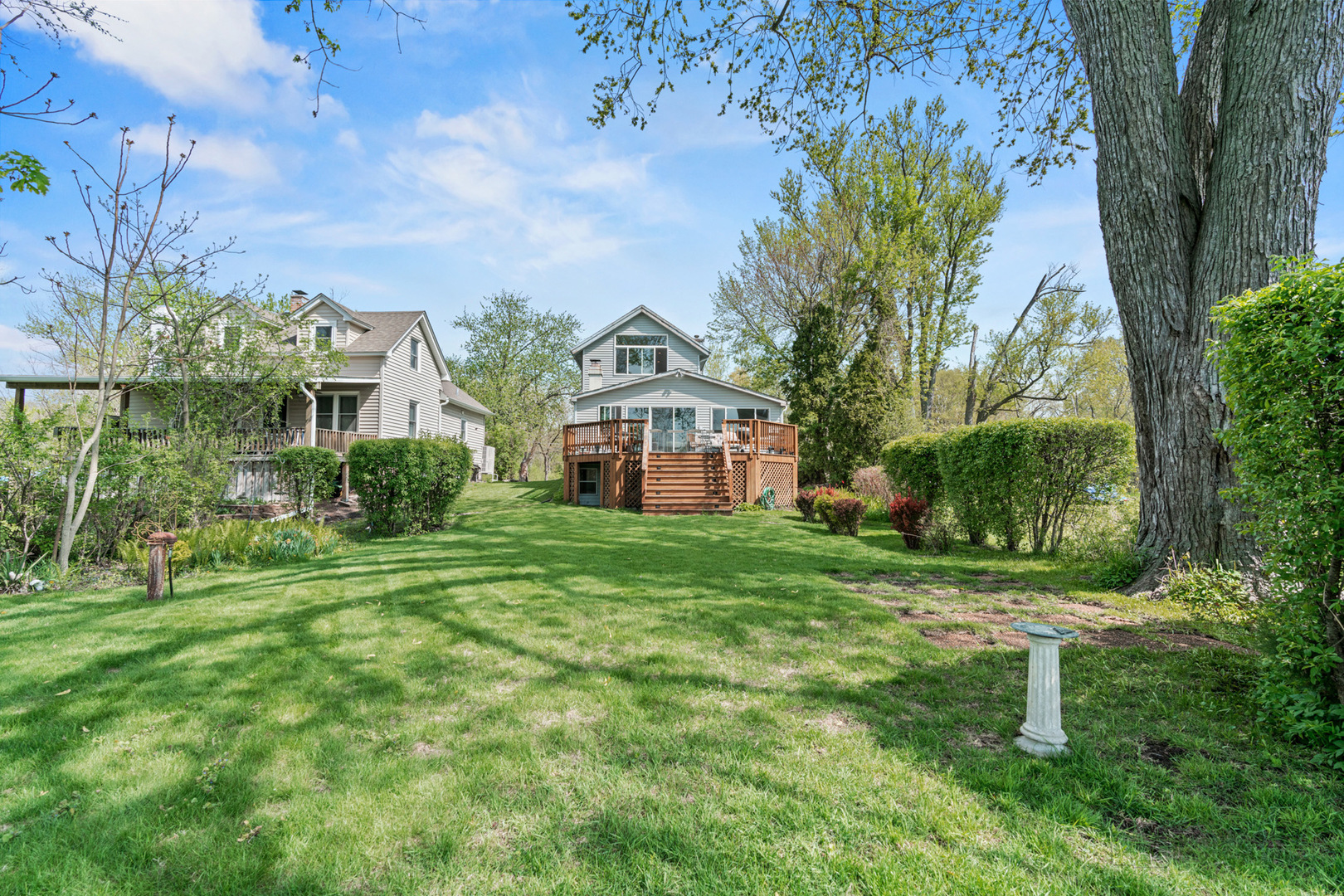 1307 Tower Lane Cary, IL 60013 - Photo 14 of 26 a view of a big yard with plants and large trees