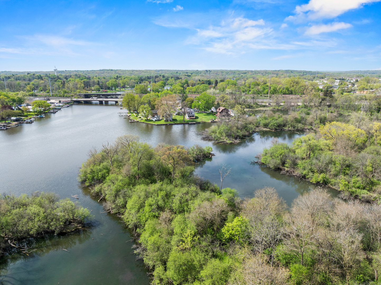 1307 Tower Lane Cary, IL 60013 - Photo 19 of 26 a view of a lake with houses in the back