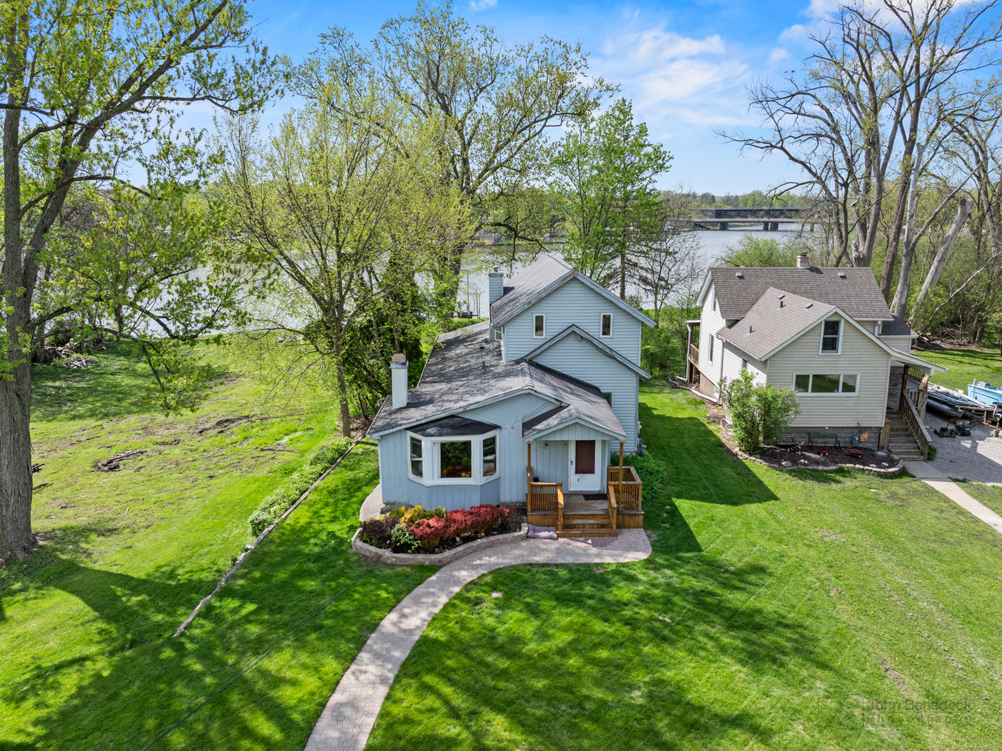 1307 Tower Lane Cary, IL 60013 - Photo 2 of 26 a aerial view of a house with swimming pool garden and patio