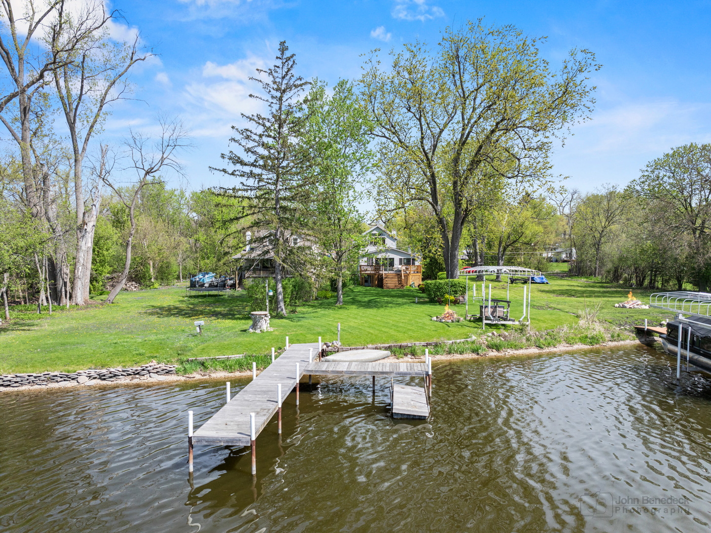 1307 Tower Lane Cary, IL 60013 - Photo 3 of 26 a view of a lake with a yard and sitting area