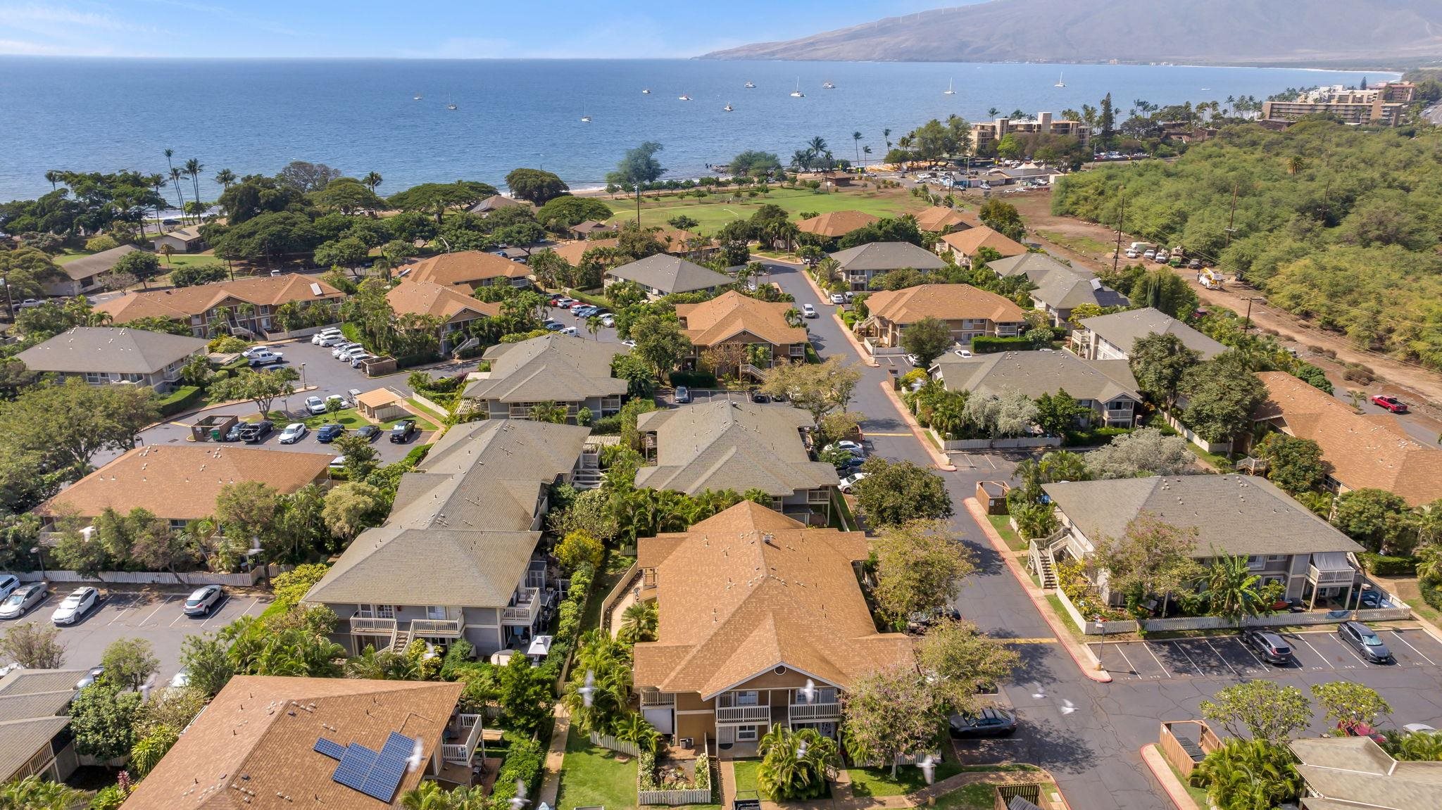 140 Uwapo Road, Unit 53201 Kihei, HI 96753 - Photo 28 of 28 an aerial view of residential houses with outdoor space