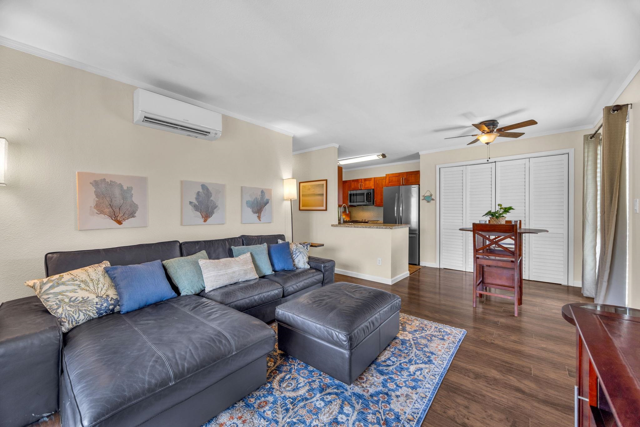 140 Uwapo Road, Unit 53201 Kihei, HI 96753 - Photo 4 of 28 a living room with furniture and wooden floor