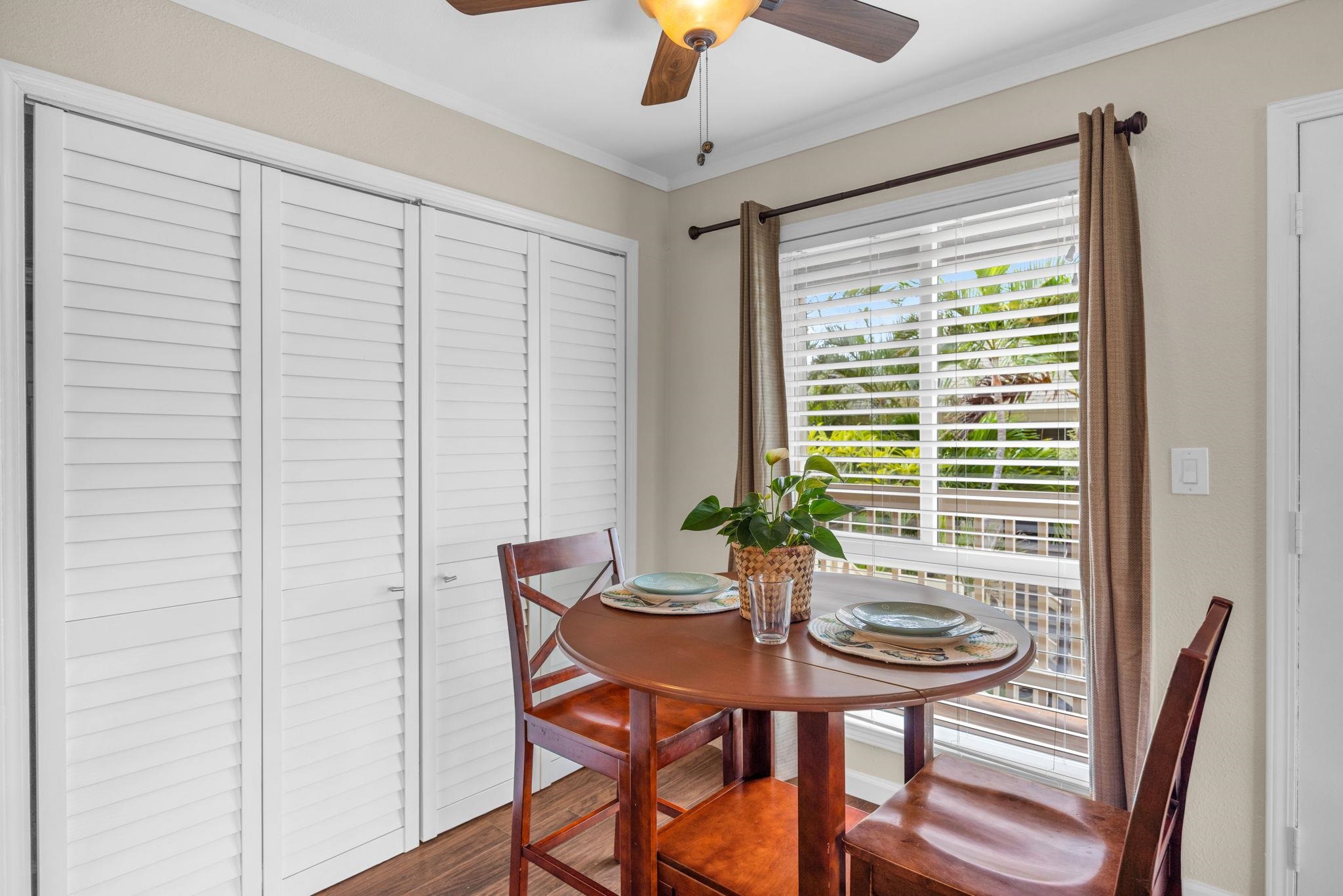 140 Uwapo Road, Unit 53201 Kihei, HI 96753 - Photo 7 of 28 a view of a dining room with furniture window and wooden floor