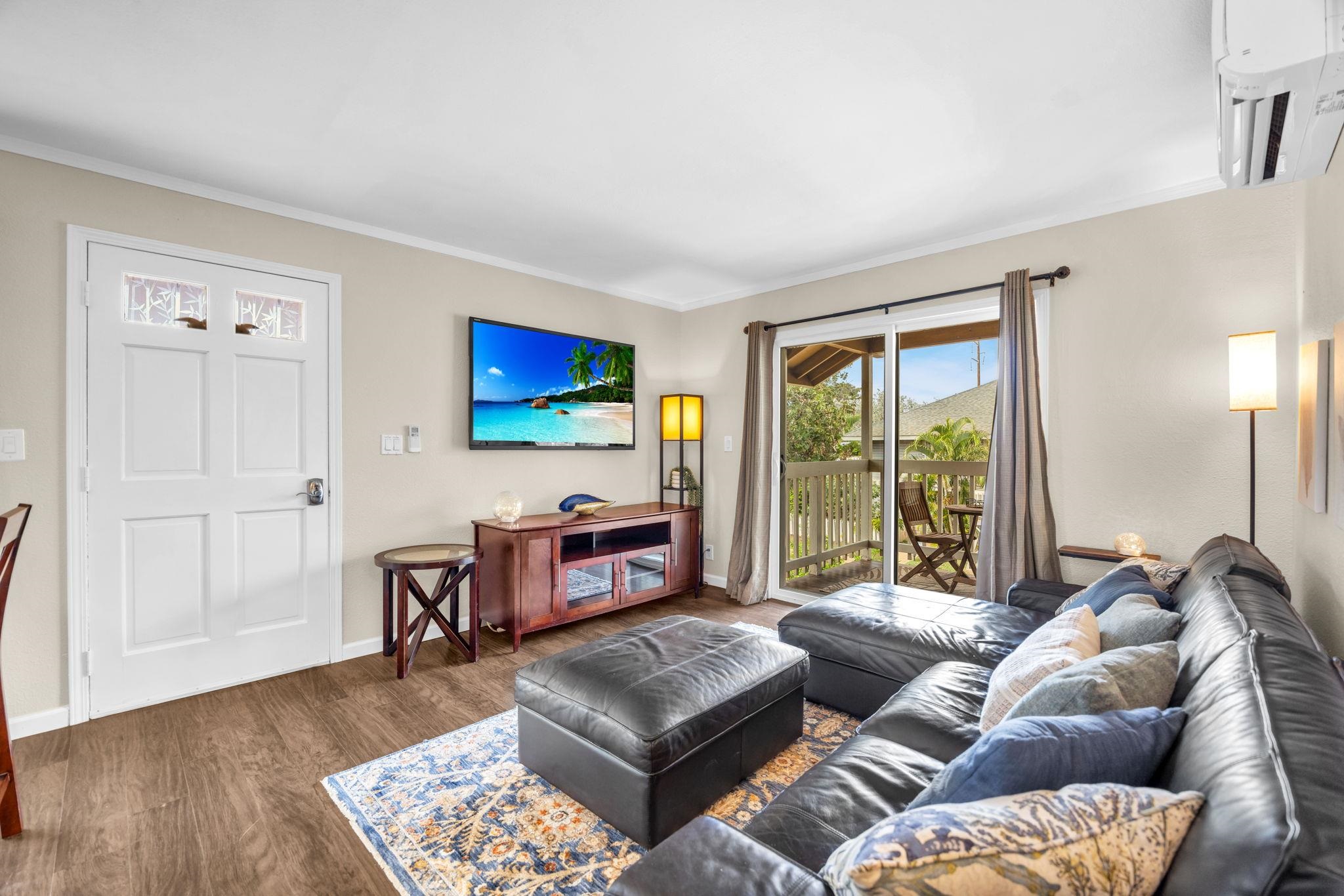 140 Uwapo Road, Unit 53201 Kihei, HI 96753 - Photo 8 of 28 a living room with furniture and a flat screen tv
