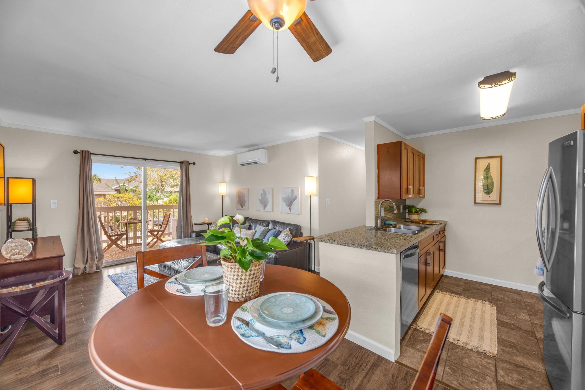 140 Uwapo Road, Unit 53201 Kihei, HI 96753 - Photo 9 of 28 a view of a dining room with furniture window and wooden floor