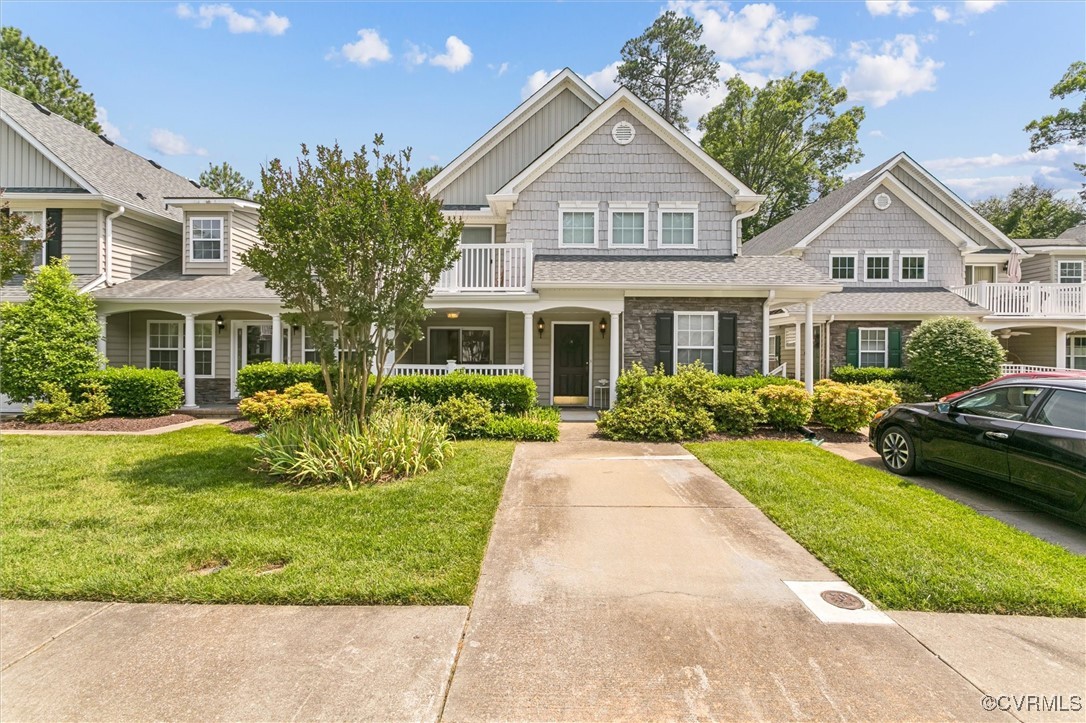 View of front facade featuring covered porch, a fr