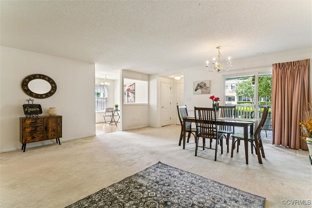 262 Claiborne Drive Williamsburg, VA 23185 - Photo 11 of 49 Carpeted dining room with a chandelier, plenty of