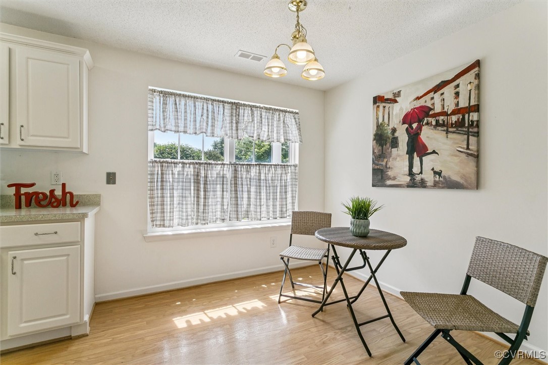 262 Claiborne Drive Williamsburg, VA 23185 - Photo 13 of 49 Dining room featuring a chandelier, light wood fin