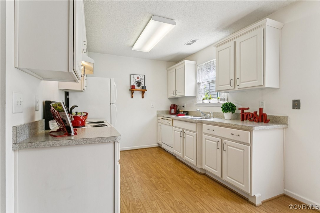 262 Claiborne Drive Williamsburg, VA 23185 - Photo 15 of 49 Kitchen with light wood-style floors, white applia