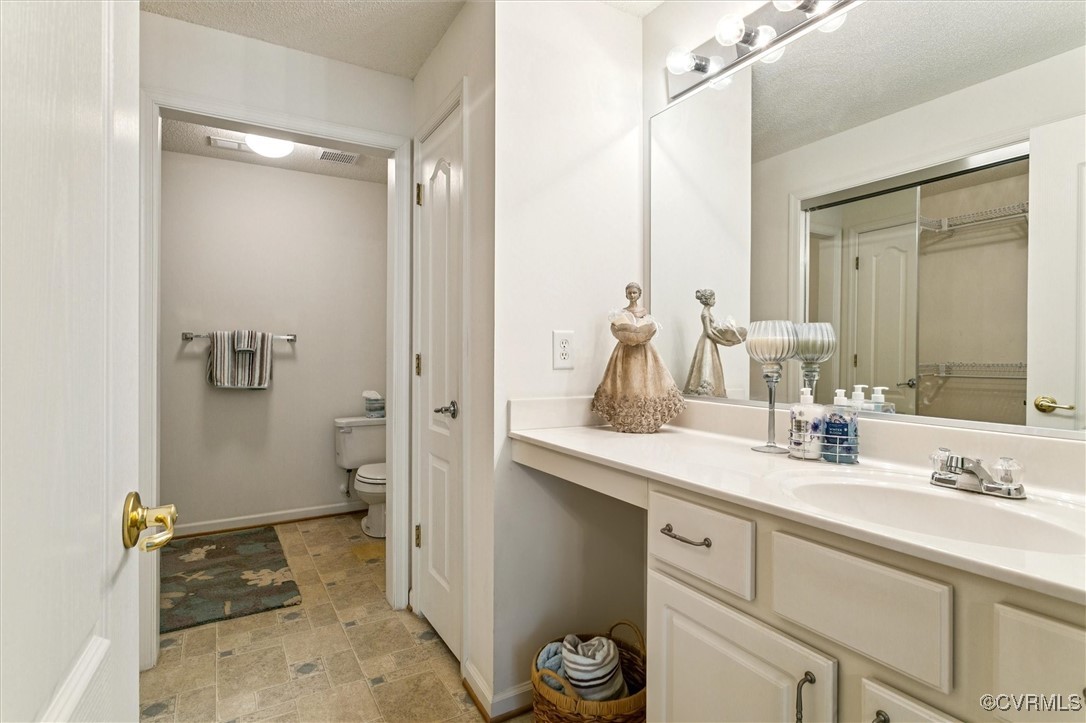 262 Claiborne Drive Williamsburg, VA 23185 - Photo 32 of 49 Bathroom featuring vanity and a closet