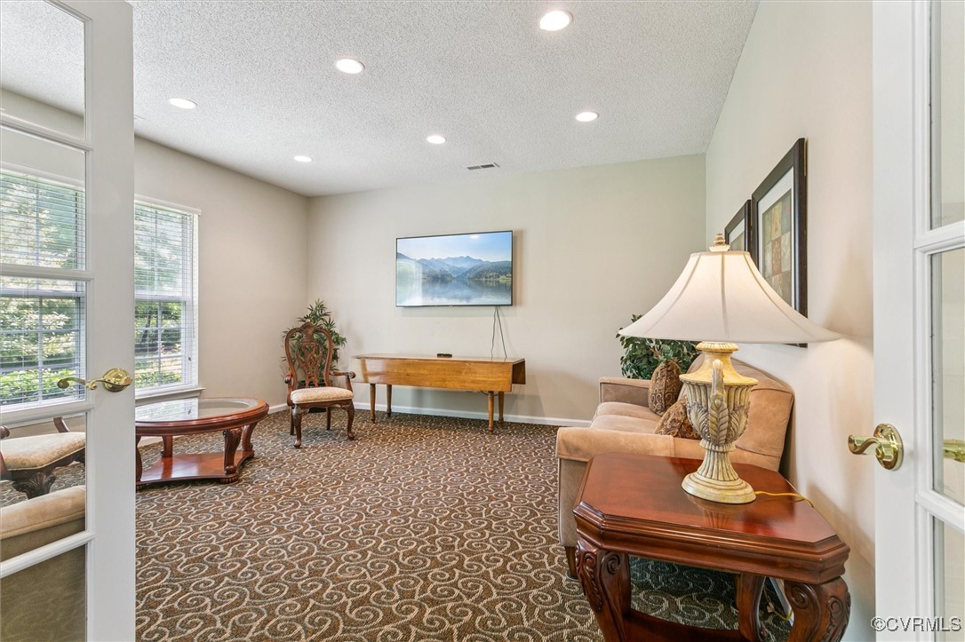 262 Claiborne Drive Williamsburg, VA 23185 - Photo 42 of 49 Sitting room with carpet, a textured ceiling, and