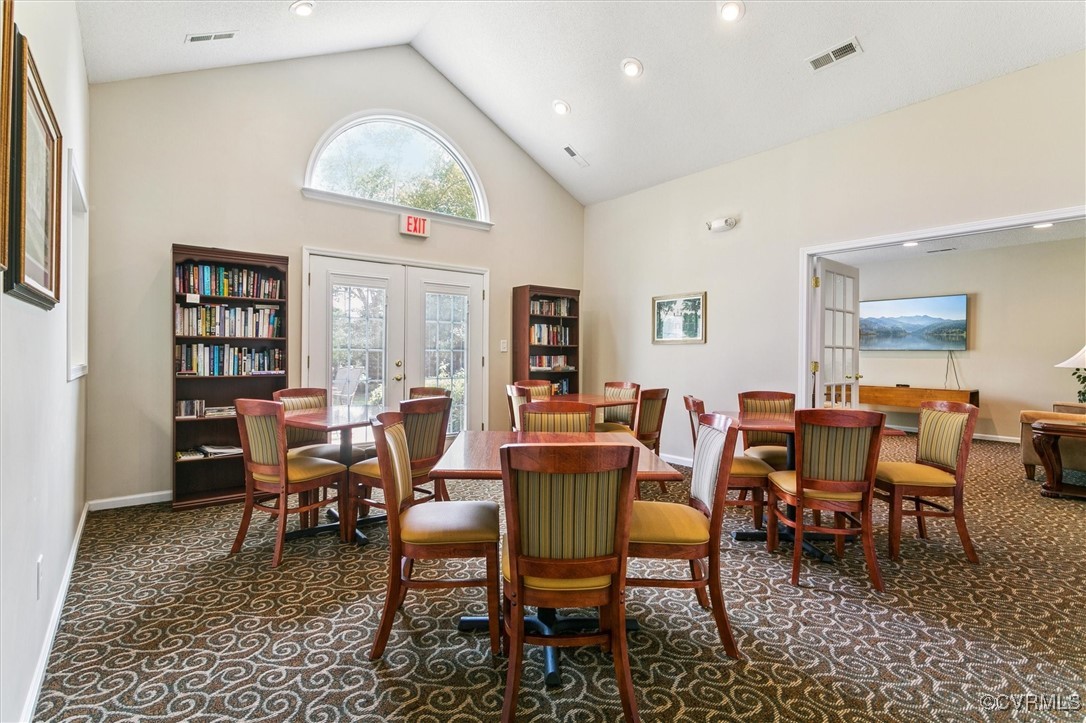 262 Claiborne Drive Williamsburg, VA 23185 - Photo 43 of 49 Carpeted dining area with high vaulted ceiling, fr