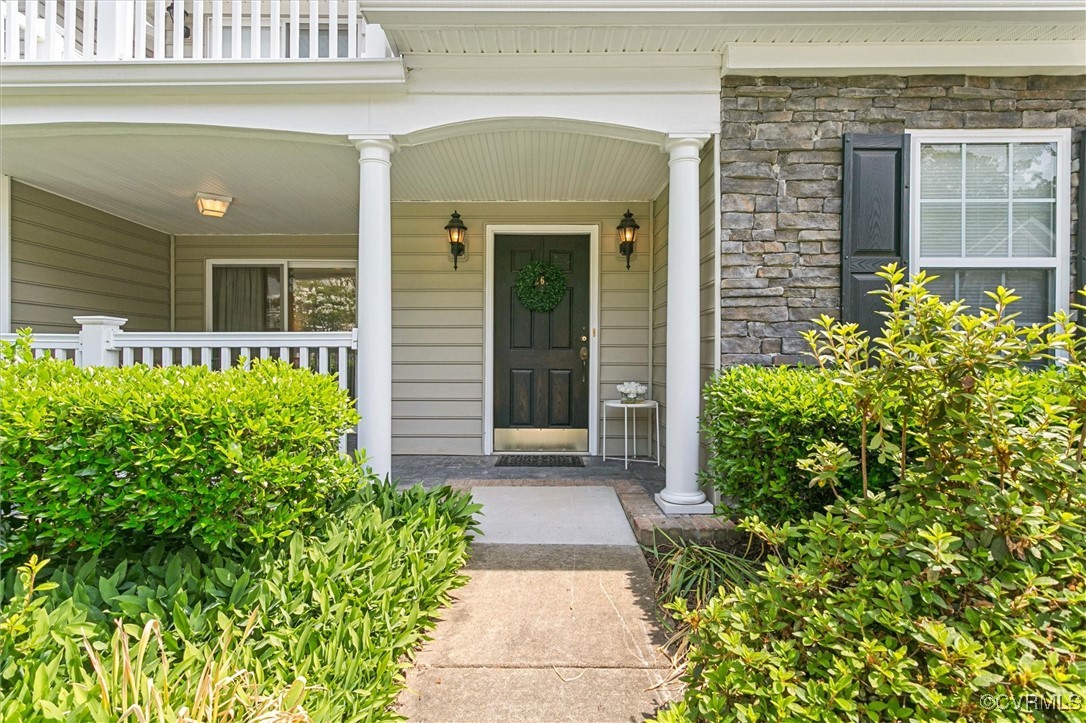 262 Claiborne Drive Williamsburg, VA 23185 - Photo 5 of 49 View of exterior entry with stone siding and a por