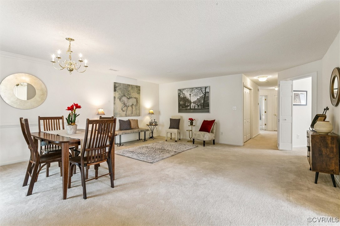 262 Claiborne Drive Williamsburg, VA 23185 - Photo 7 of 49 Dining space with light carpet, a chandelier, and