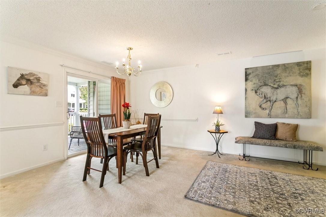 262 Claiborne Drive Williamsburg, VA 23185 - Photo 8 of 49 Dining area with a chandelier, a textured ceiling,