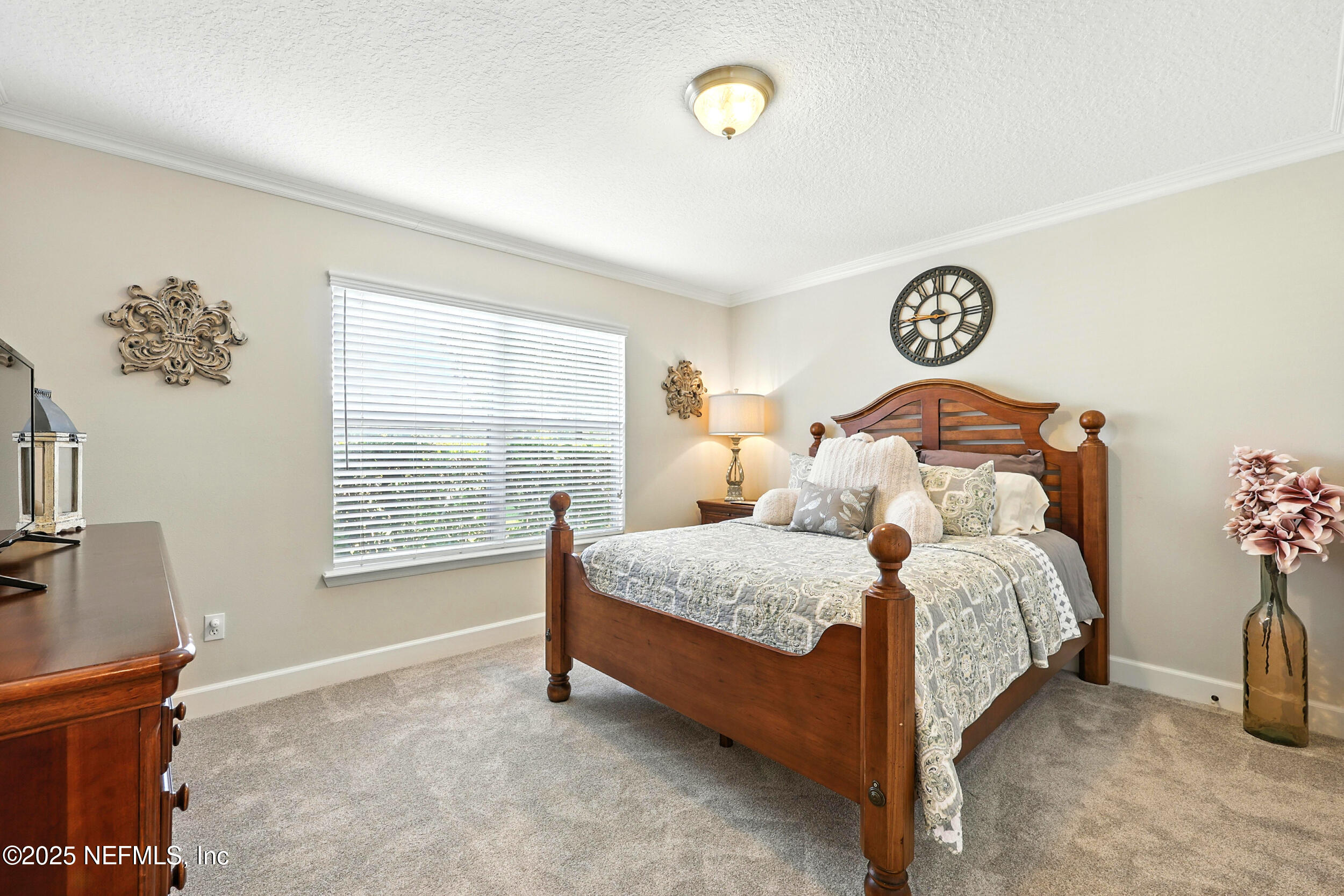 1185 Garrison Drive St. Augustine, FL 32092 - Photo 27 of 70 a bedroom with a bed and a window