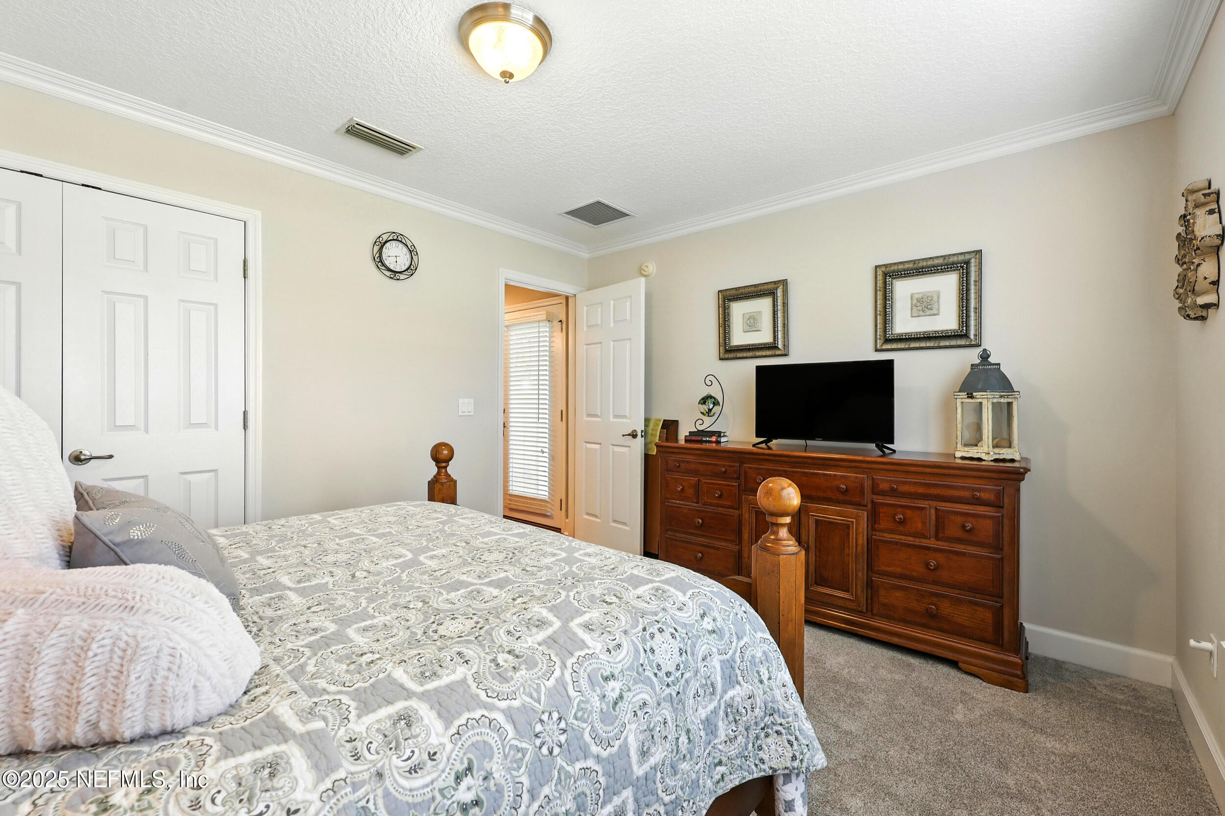 1185 Garrison Drive St. Augustine, FL 32092 - Photo 28 of 70 a bedroom with a bed and a television