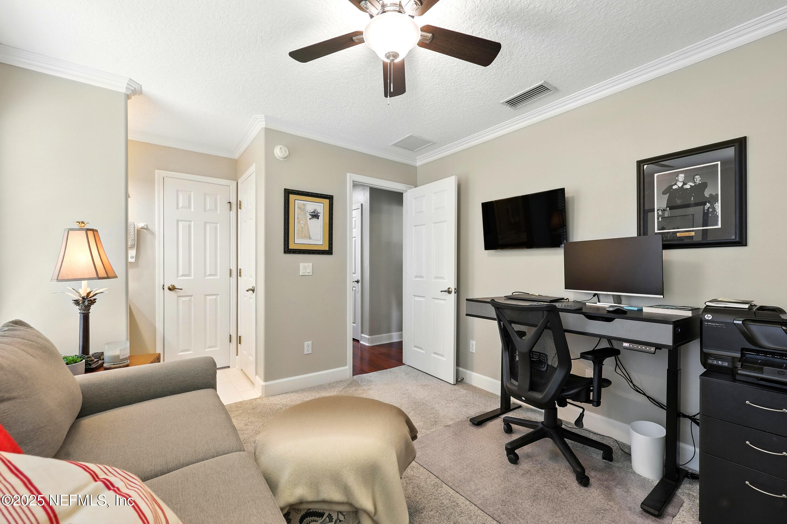 1185 Garrison Drive St. Augustine, FL 32092 - Photo 31 of 70 a view of a livingroom with workspace and a couch