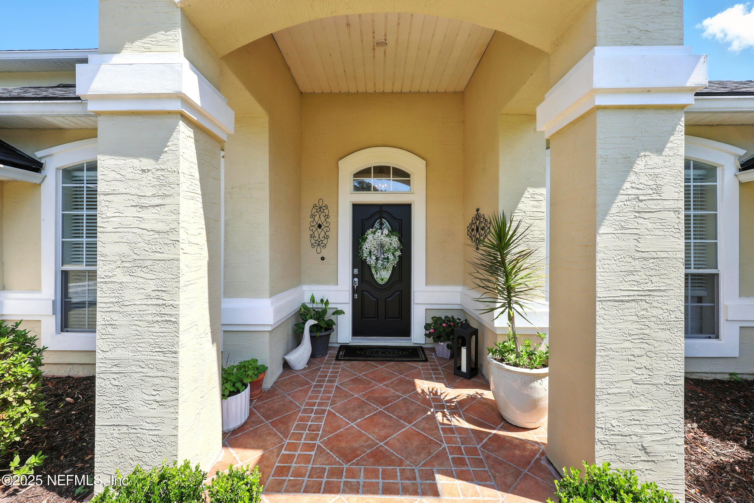 1185 Garrison Drive St. Augustine, FL 32092 - Photo 4 of 70 a front view of a house with garden