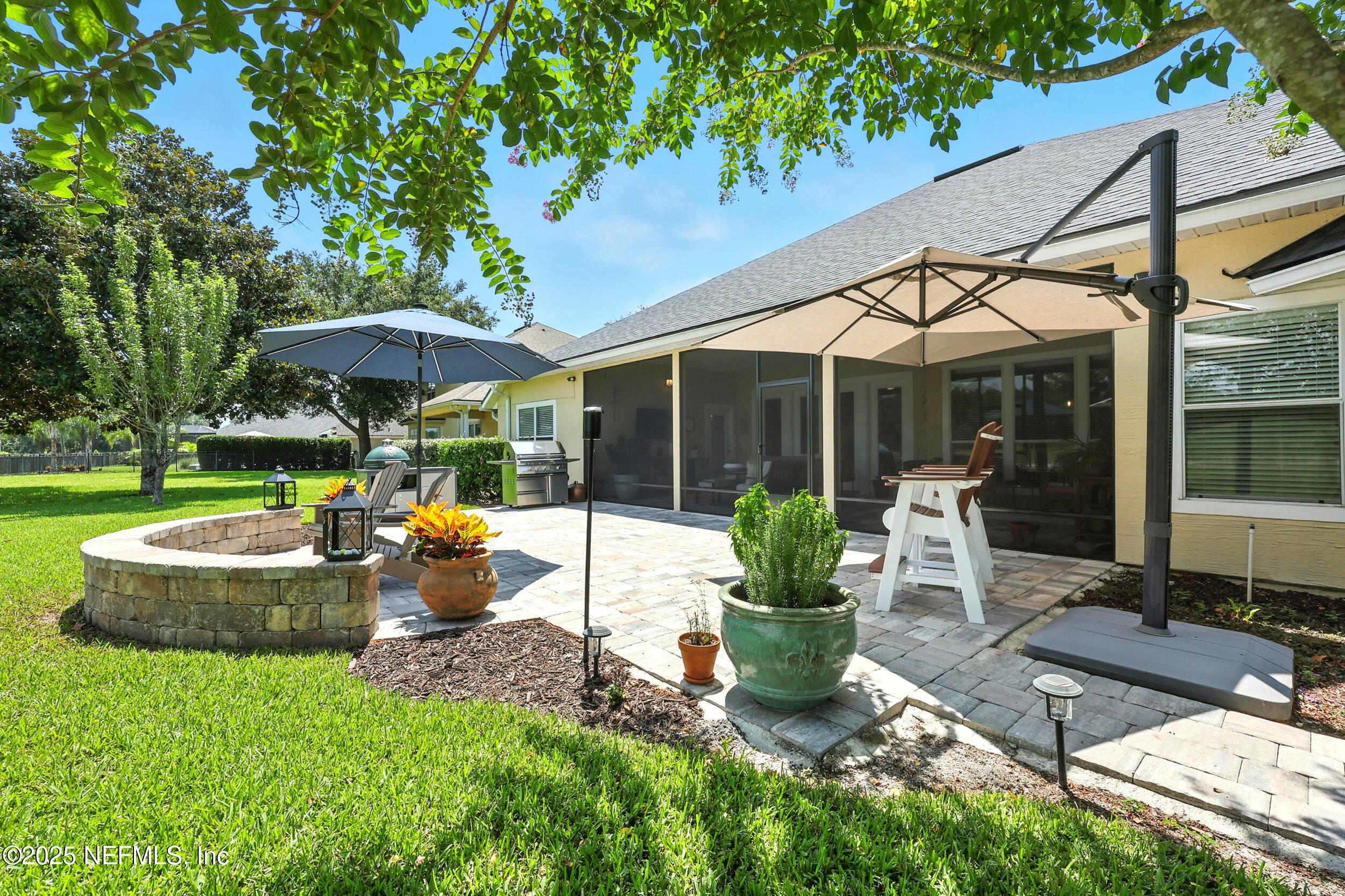 1185 Garrison Drive St. Augustine, FL 32092 - Photo 47 of 70 a view of a house with backyard sitting area and garden