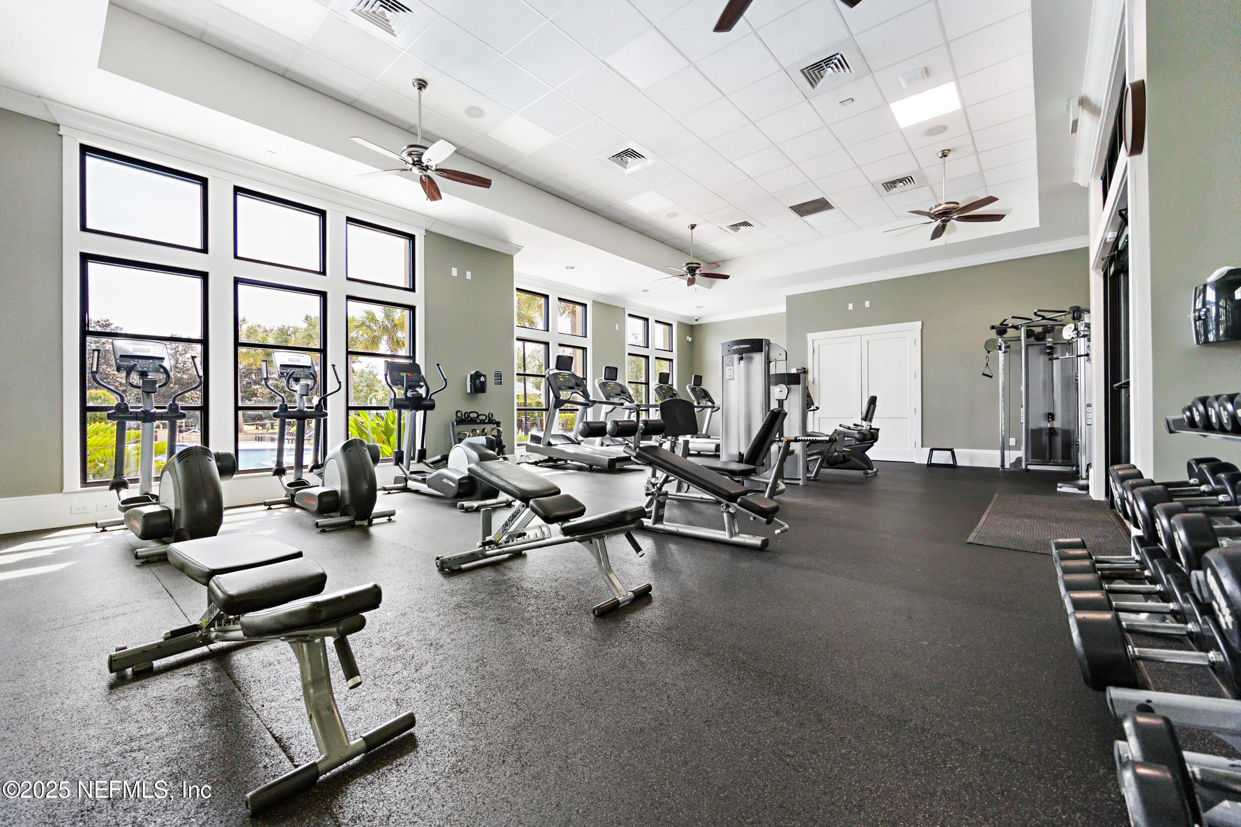 1185 Garrison Drive St. Augustine, FL 32092 - Photo 62 of 70 a living room with furniture gym equipment and a large window