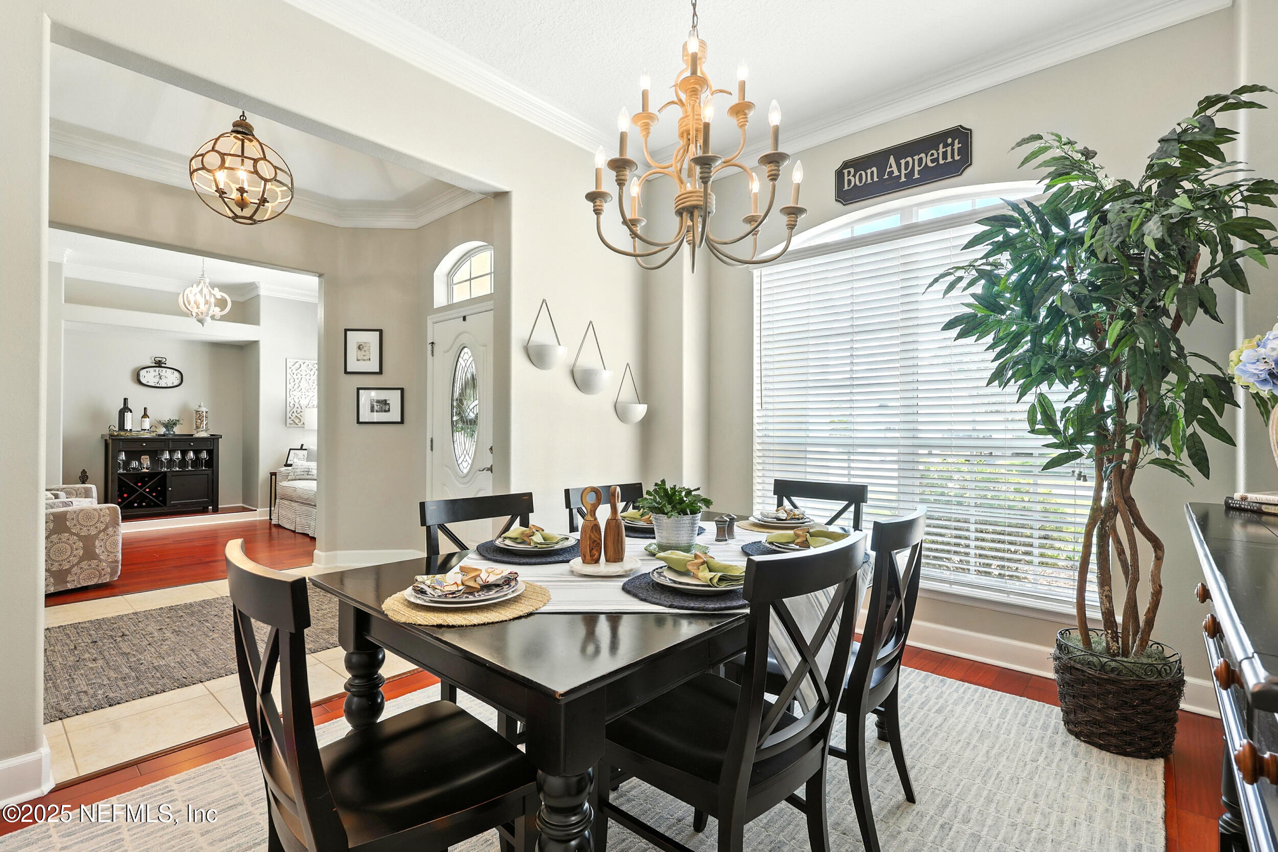 1185 Garrison Drive St. Augustine, FL 32092 - Photo 8 of 70 a view of a dining room with furniture wooden floor and chandelier