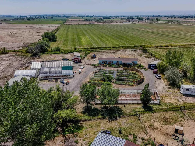 an aerial view of a house with a lake view