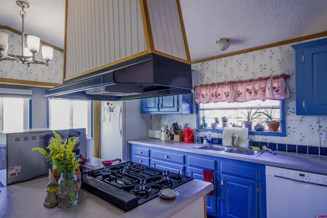 a spacious bedroom with a bed and a cabinets