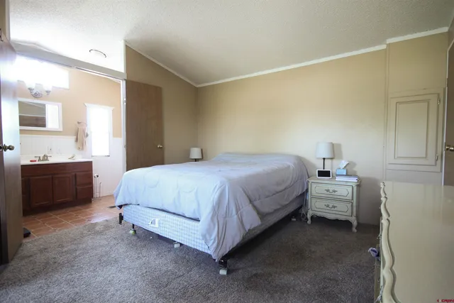 a bathroom with a sink mirror and toilet