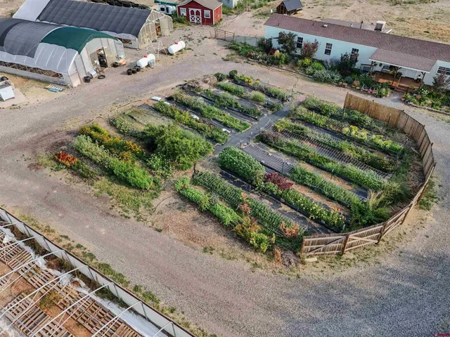 an aerial view of a house with lake view