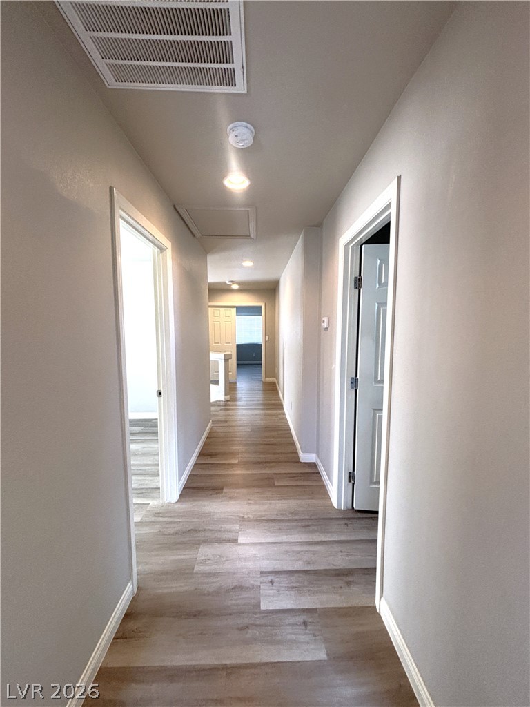 6425 Jackson Spring Road Las Vegas, NV 89118 - Photo 19 of 31 Well-lit hallway featuring light-toned flooring and contemporary recessed lighting.