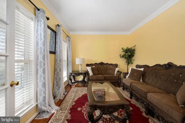 a view of a dining room with furniture and window