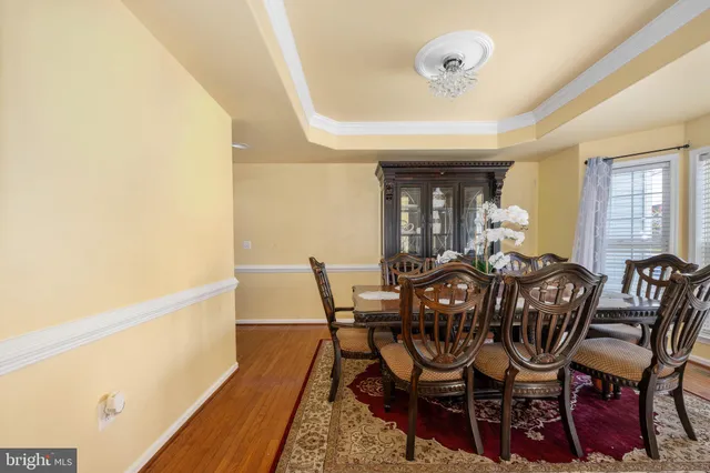 a living room with furniture fireplace and window