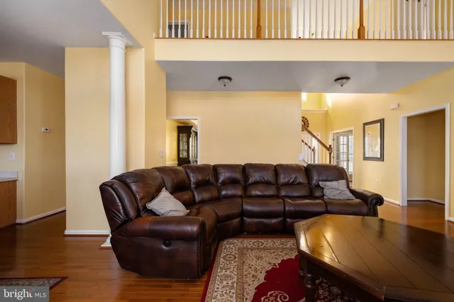 a large kitchen with kitchen island a large counter top space appliances and cabinets