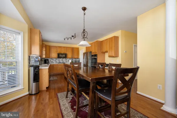 a kitchen with stainless steel appliances a sink stove and cabinets