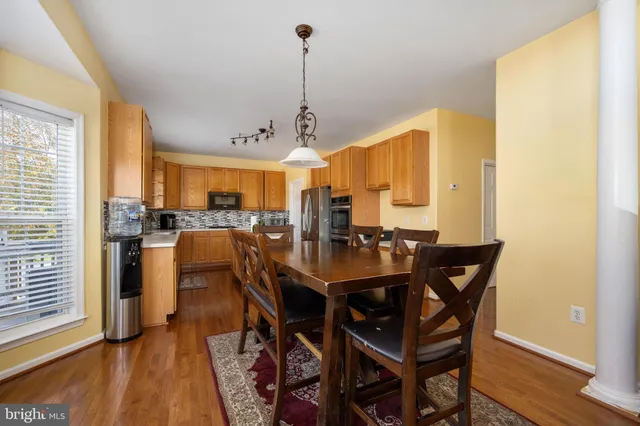 a kitchen with stainless steel appliances a sink stove and cabinets