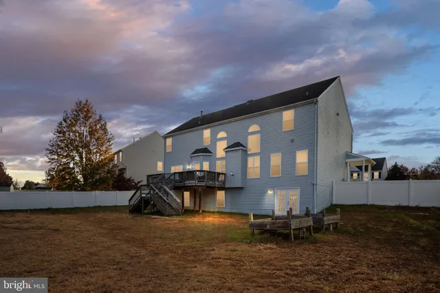 a front view of a house with patio yard and outdoor seating